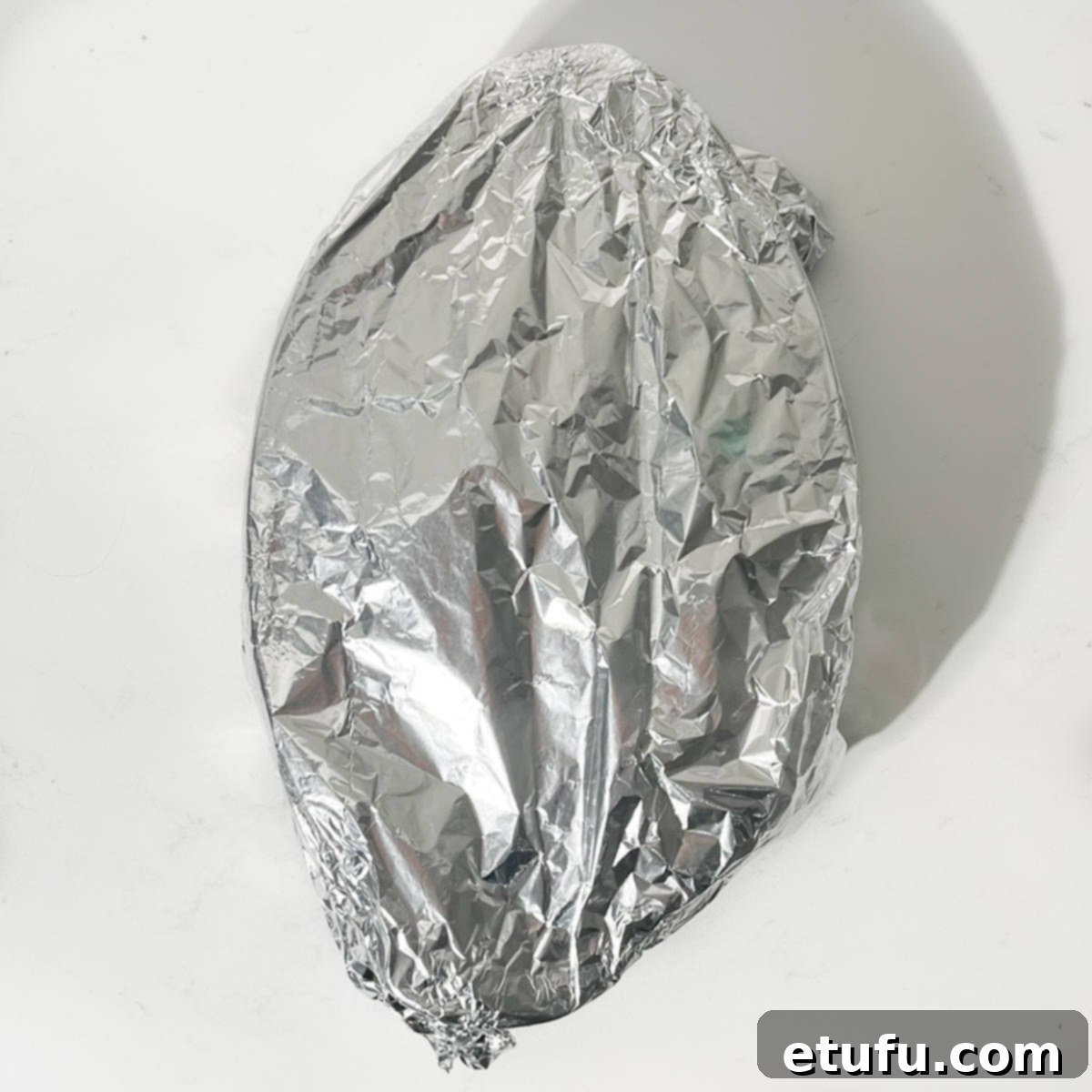 Eve's pudding covered with foil.