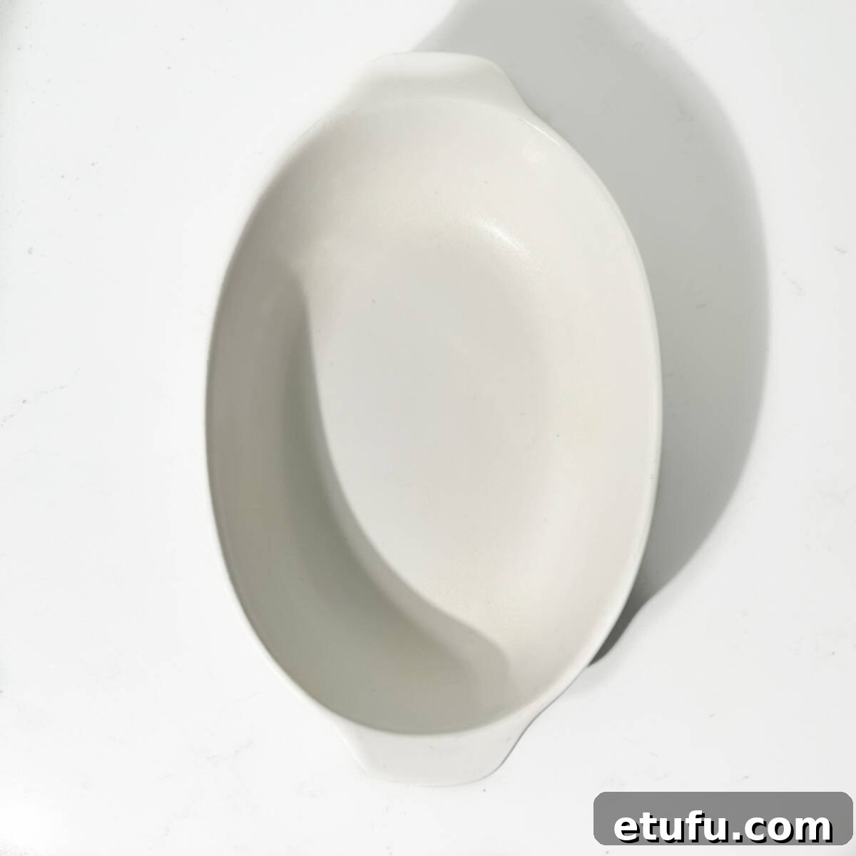 A lightly buttered baking dish.