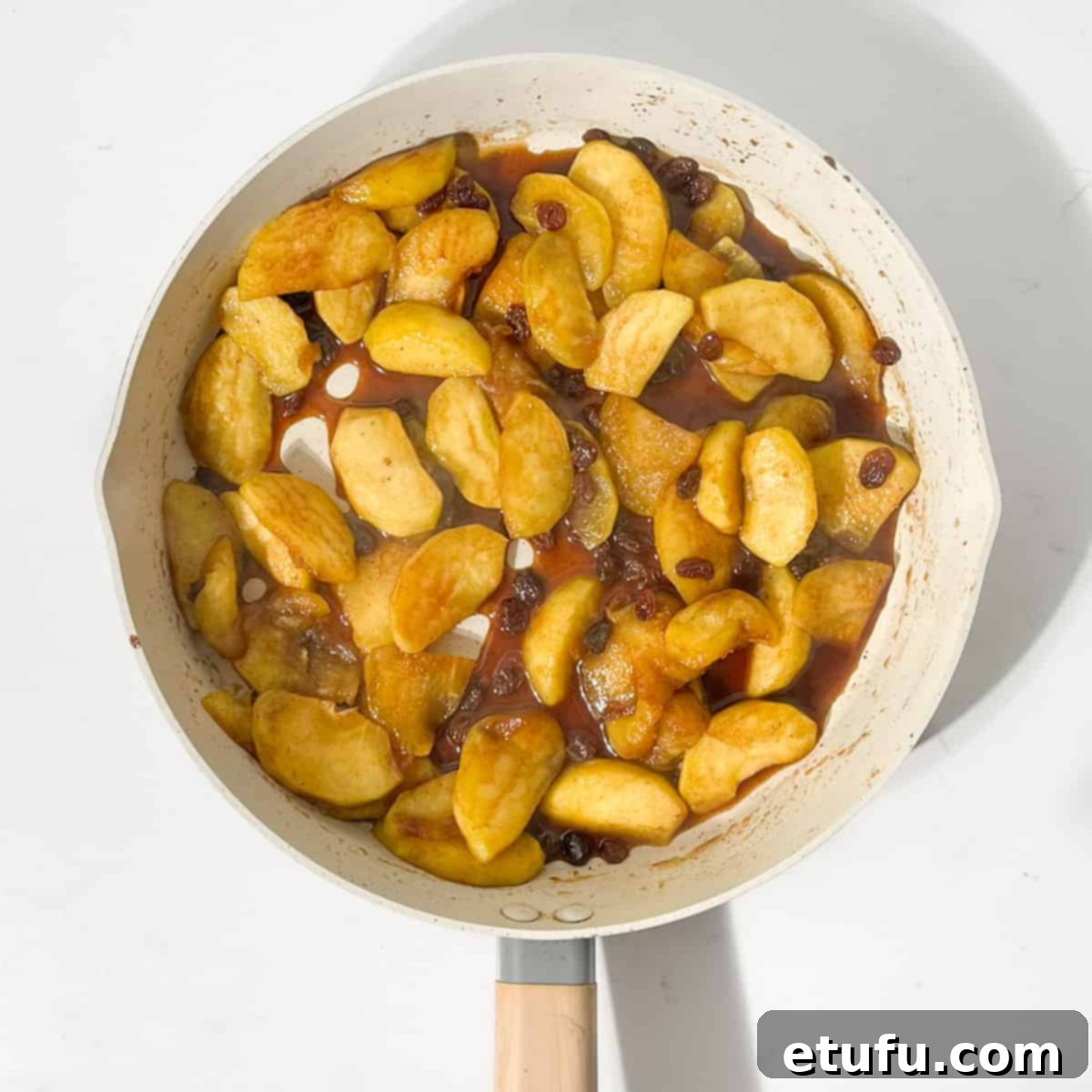 Cooked apples for the Eve's pudding in a large pan.