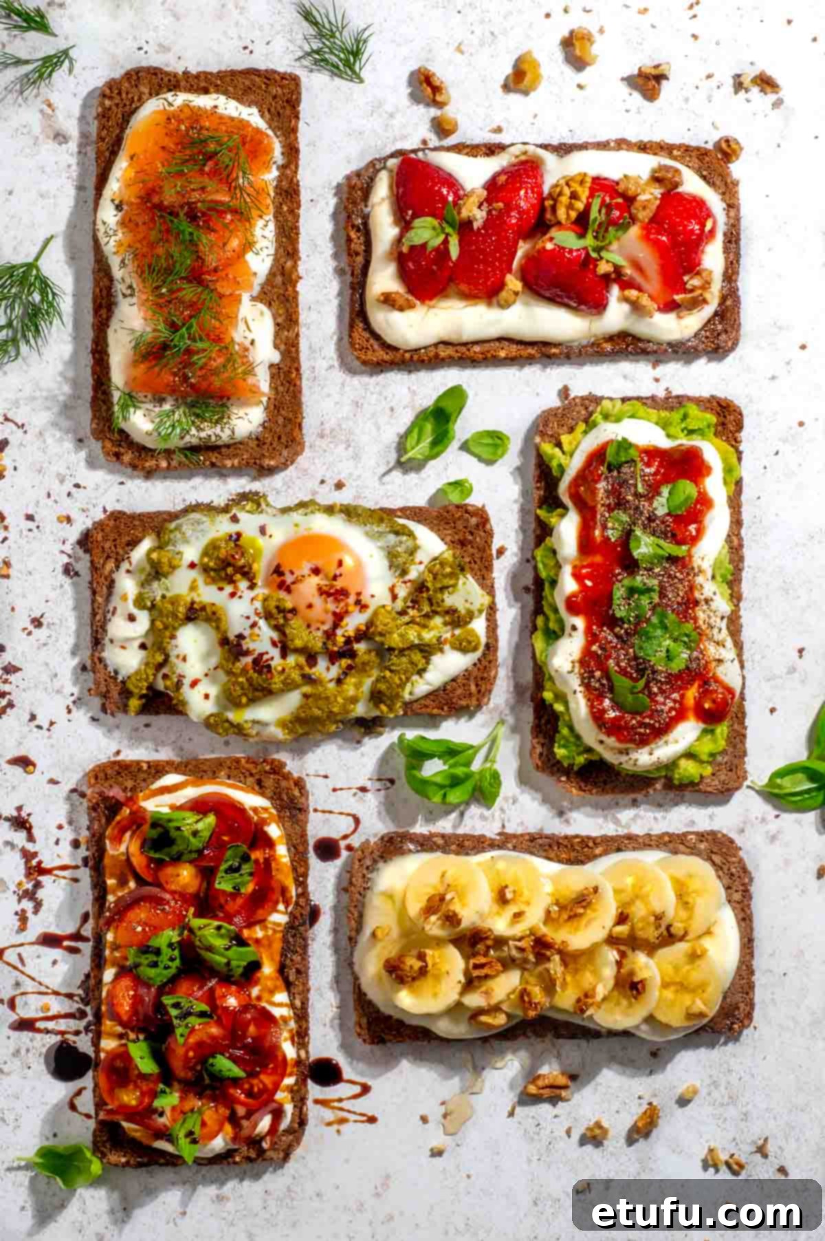 Six slices of toast topped with cottage cheese and various vibrant toppings.
