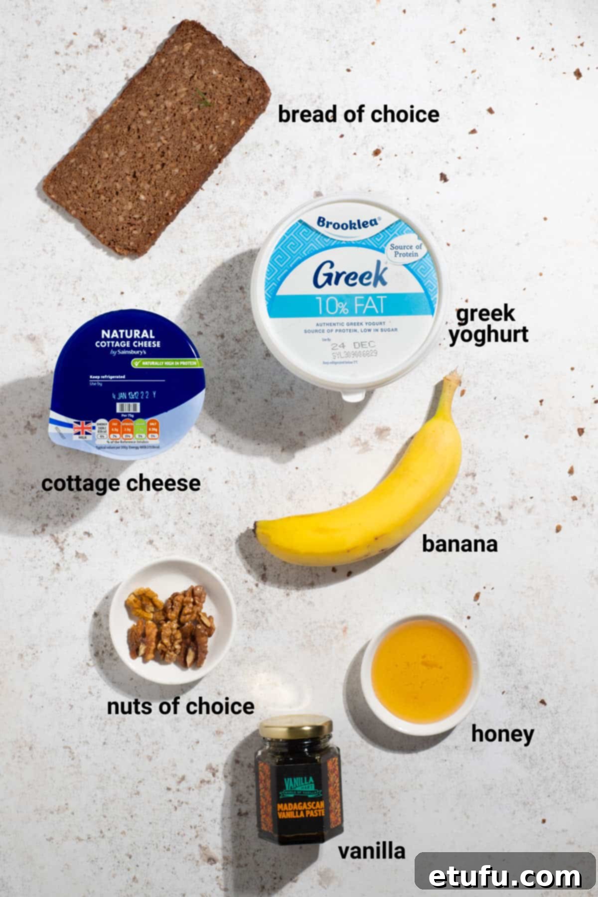 Ingredients for banana and honey cottage cheese toast, including bananas, honey, and a cottage cheese mix.
