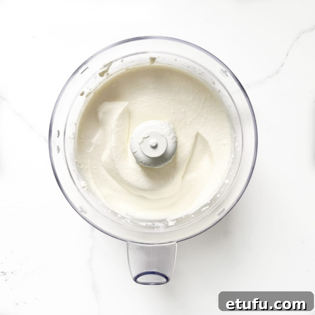 Smooth, whipped cottage cheese for cottage cheese toast in a food processor, ready to be served.