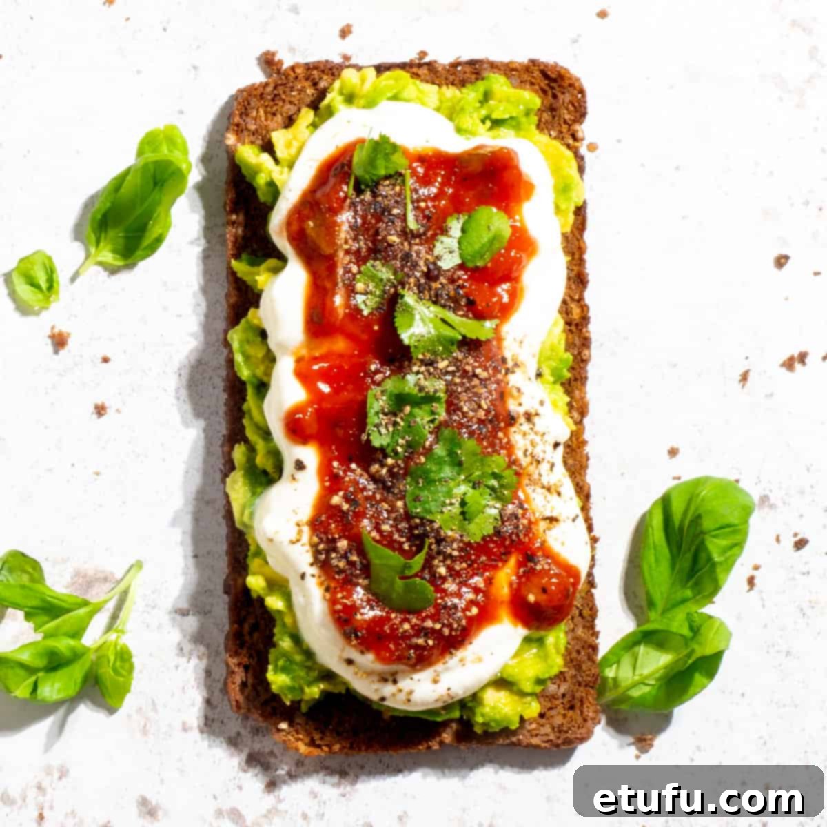 Cottage cheese toast generously topped with mashed avocado and vibrant salsa.