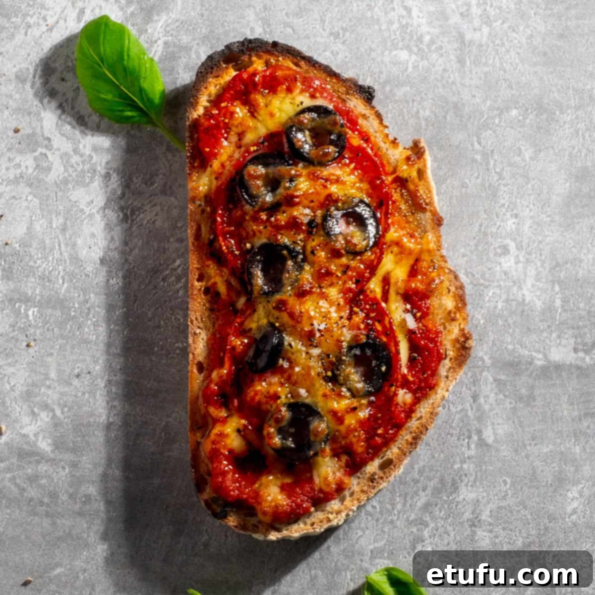 Pepperoni pizza toast on a grey background.