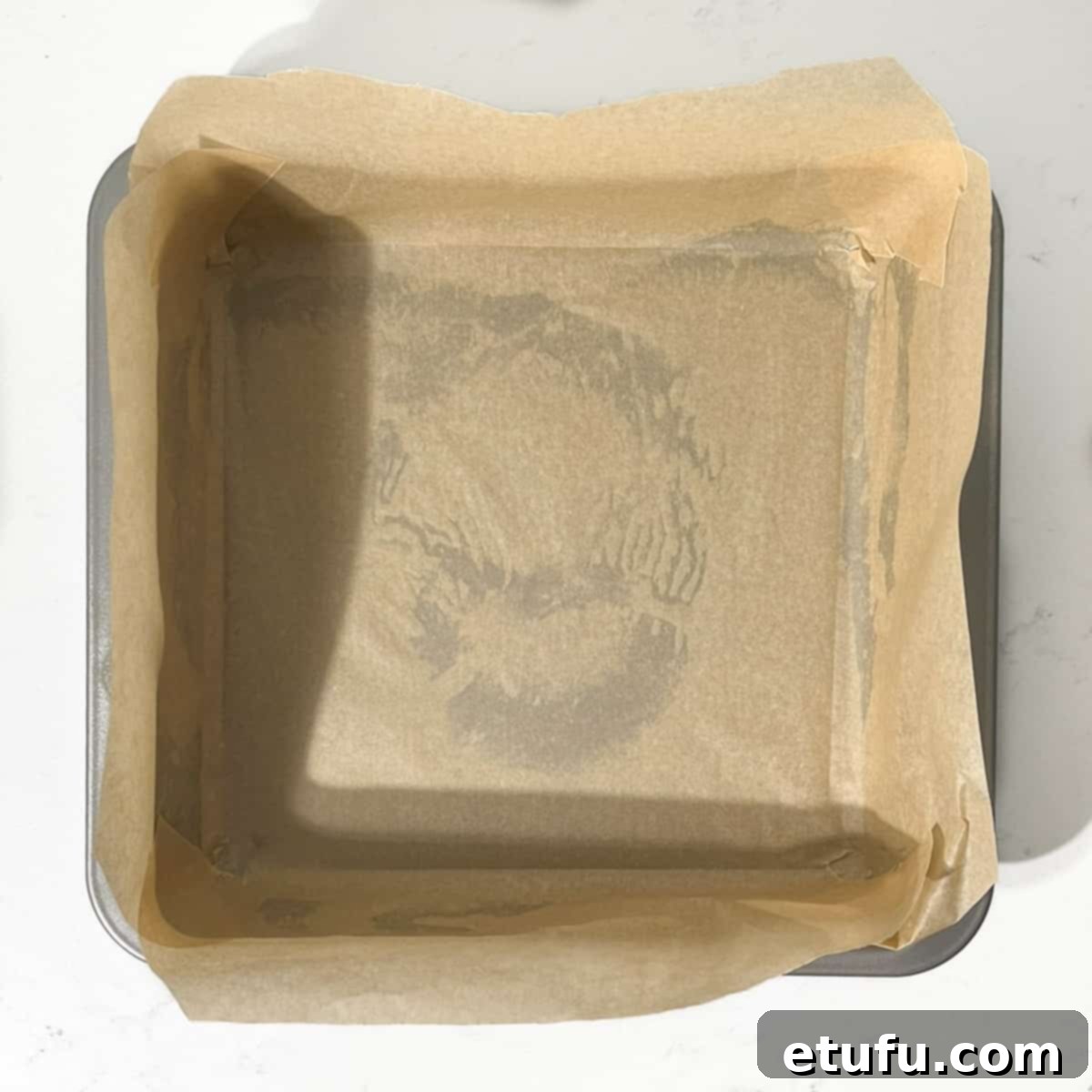 A lined square baking tin.