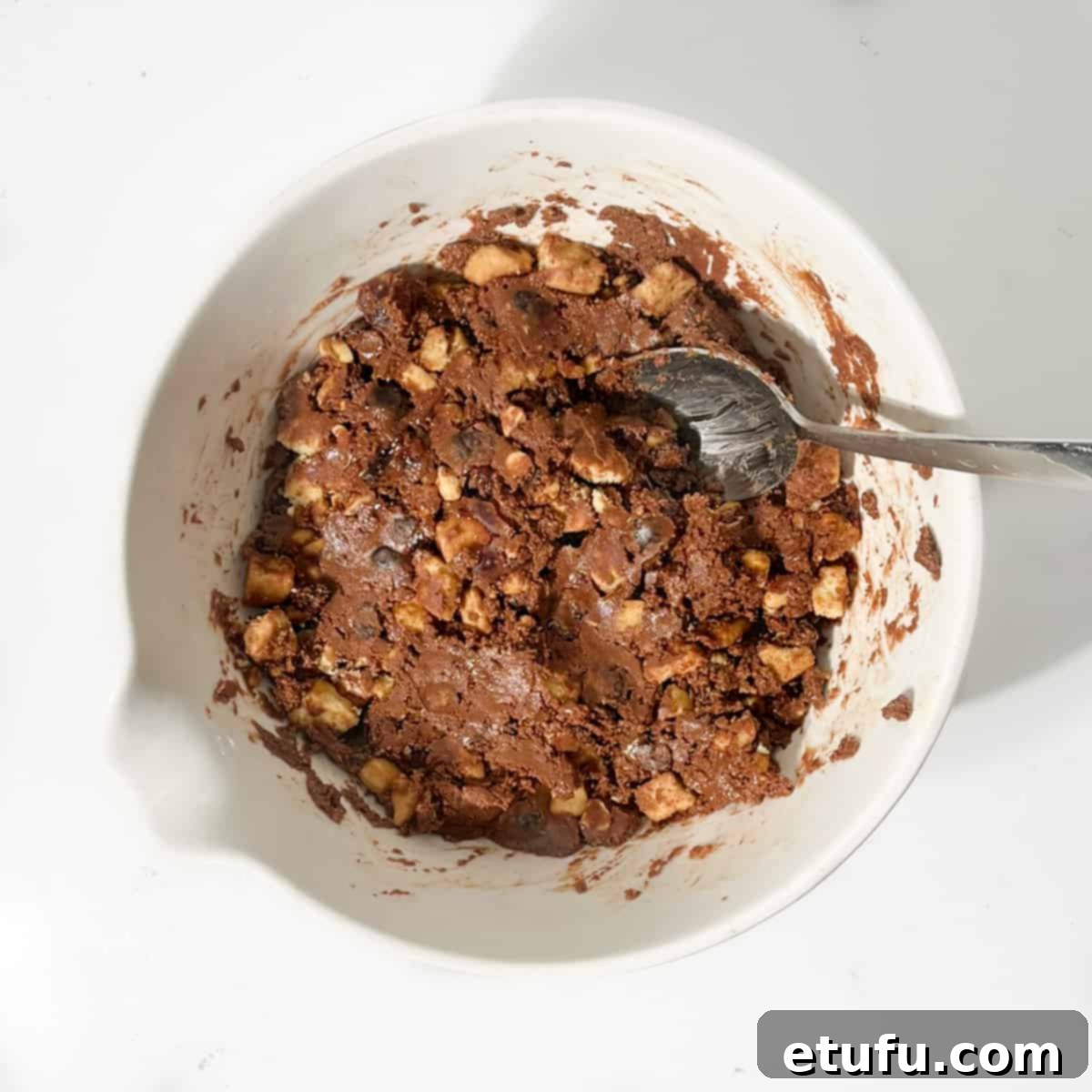 Chocolate tiffin mixture in a large white bowl.
