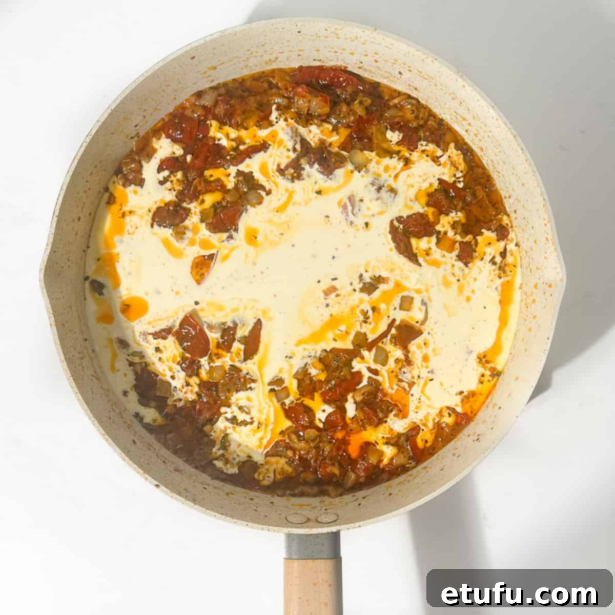 Exquisite Tuscan Marry Me Chicken Pasta 13 Adding the cream into the marry me chicken pasta sauce.