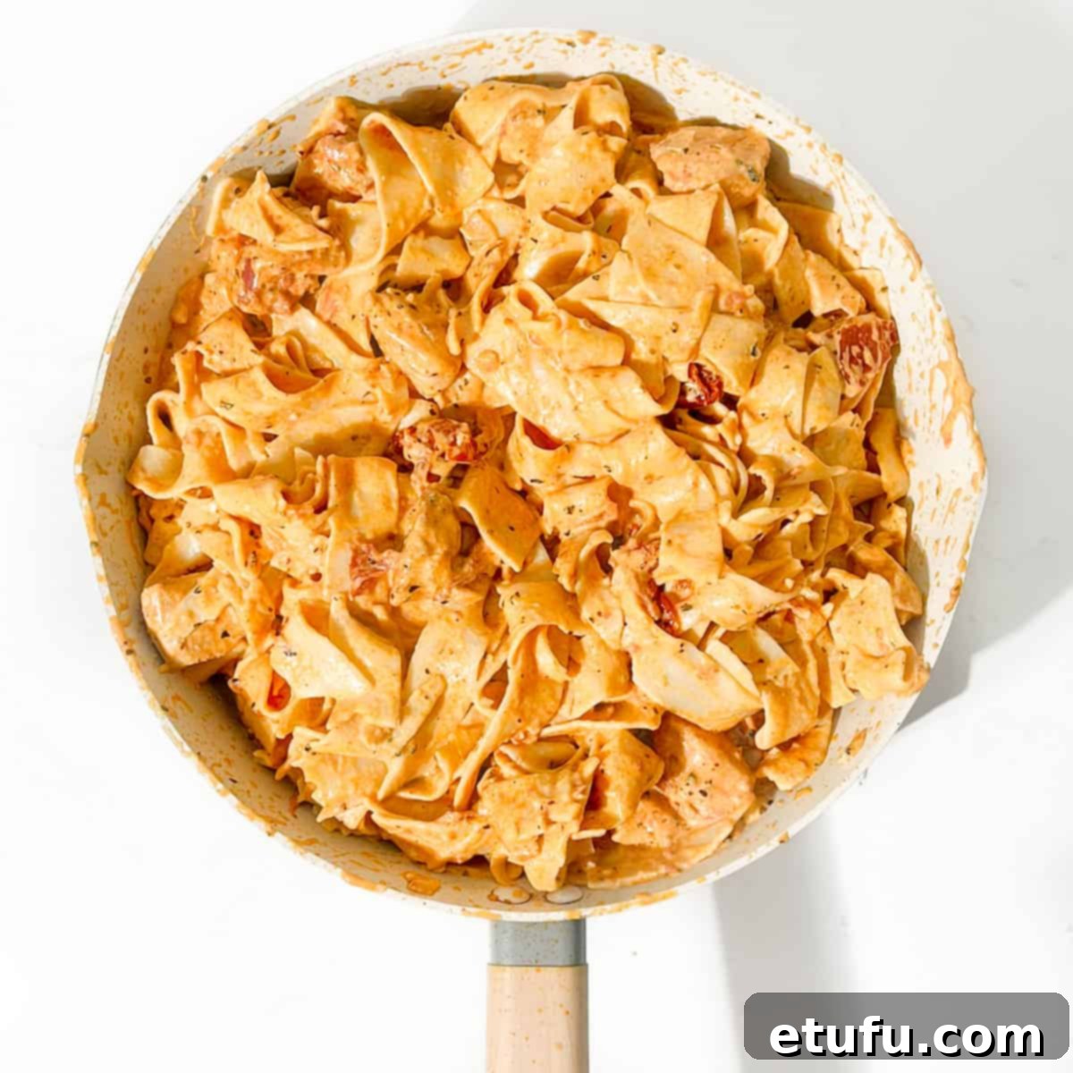 Exquisite Tuscan Marry Me Chicken Pasta 17 Cooked marry me chicken pasta in a large saucepan, ready for serving.