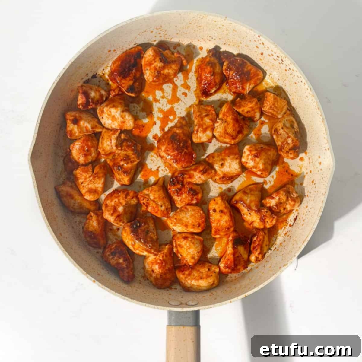 Exquisite Tuscan Marry Me Chicken Pasta 8 Cooking the chicken in a large frying pan for the marry me chicken pasta.