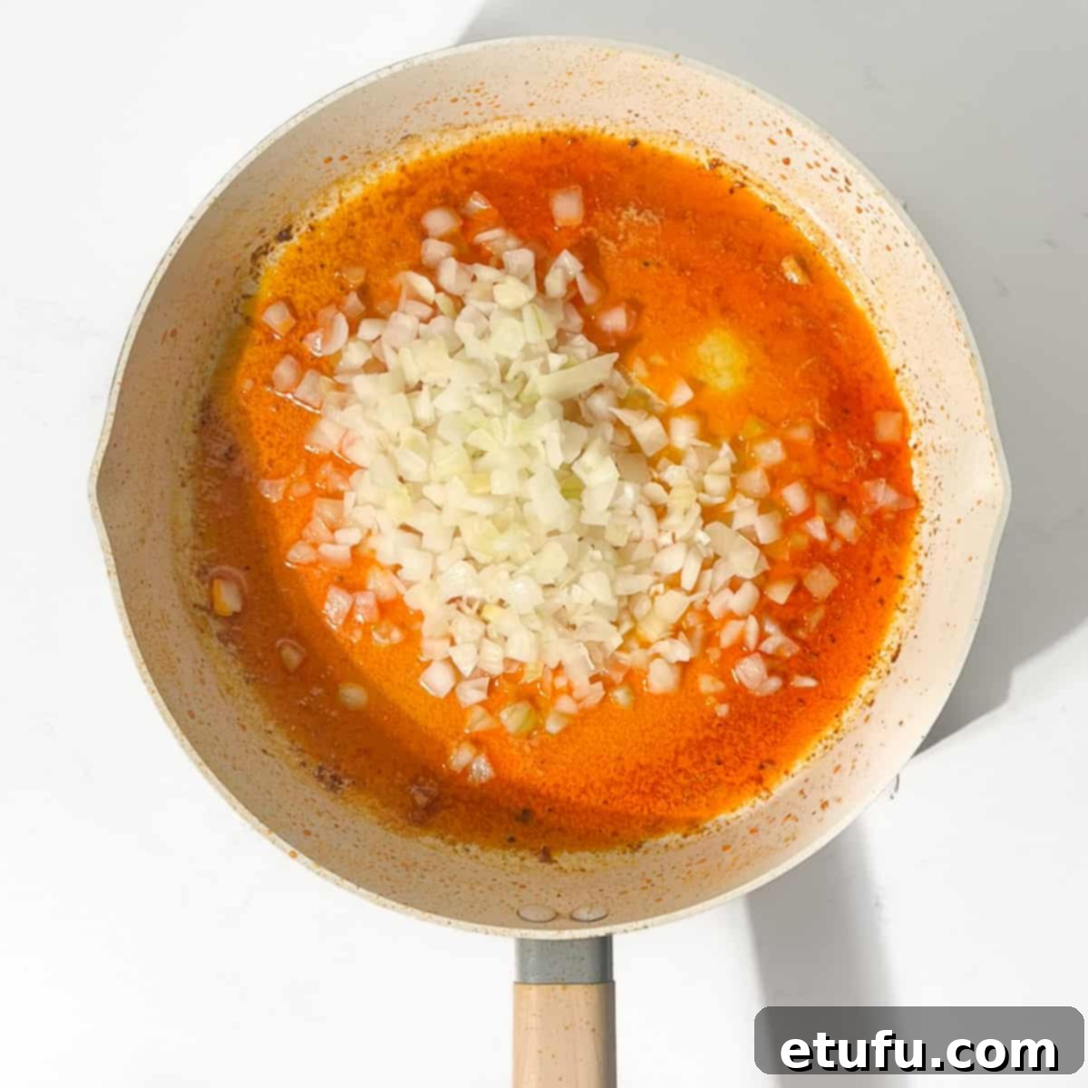 Exquisite Tuscan Marry Me Chicken Pasta 9 Adding the onions for the marry me chicken pasta to the melted butter and oil.