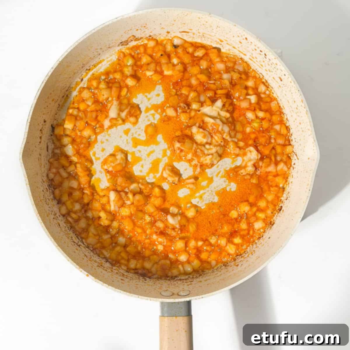 Exquisite Tuscan Marry Me Chicken Pasta 10 Adding the garlic to the pan with the onions.