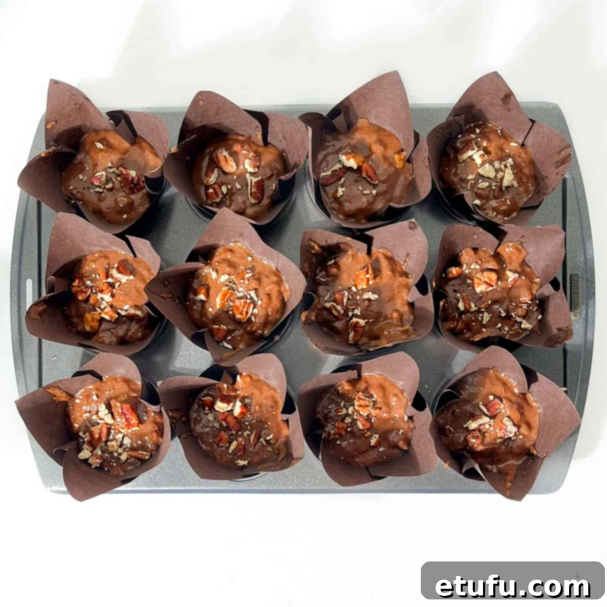 Golden Banana Chocolate Chunk Muffins 19 Muffin mixture scooped into the muffin liners.