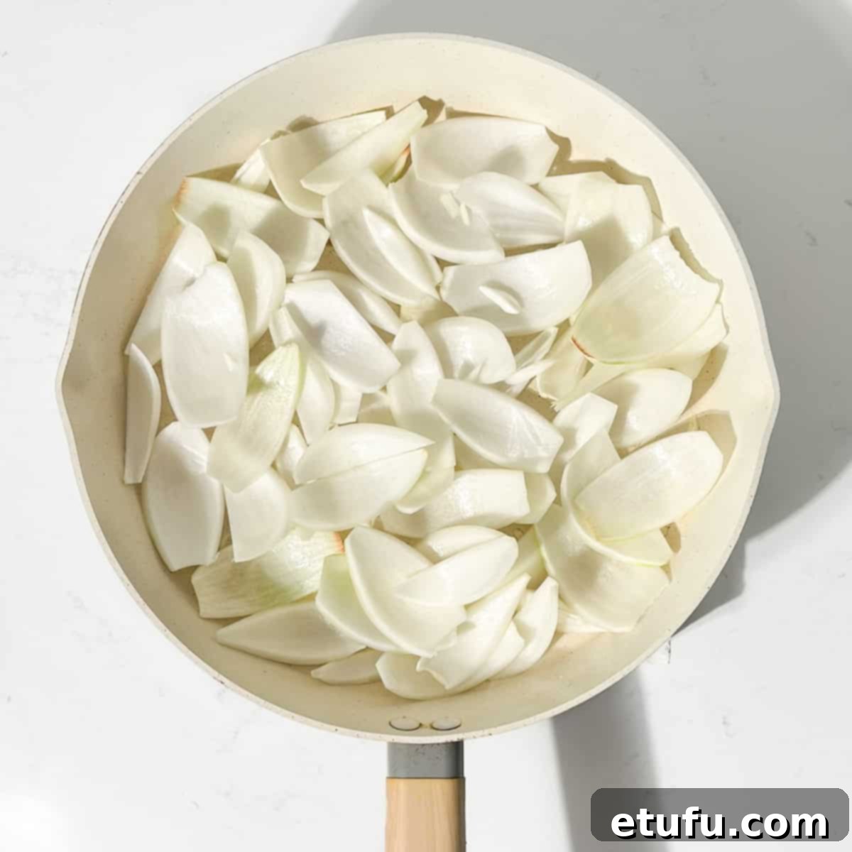 Frying the onion petals for the chicken dopiaza.
