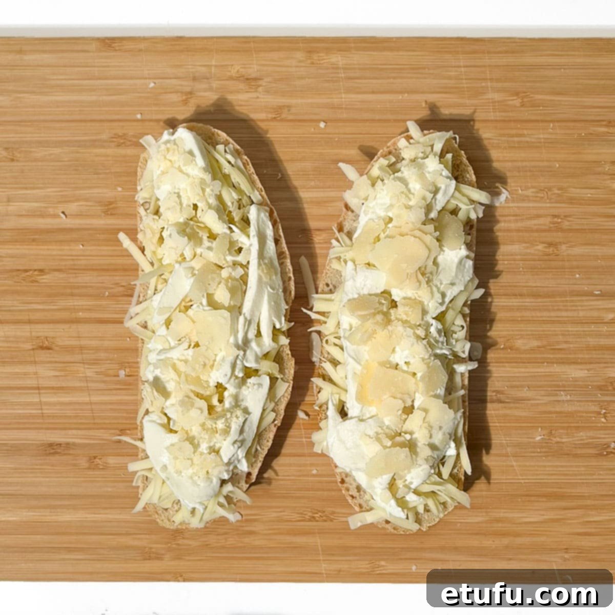 Parmesan shavings added on top of the mozzarella cheese.