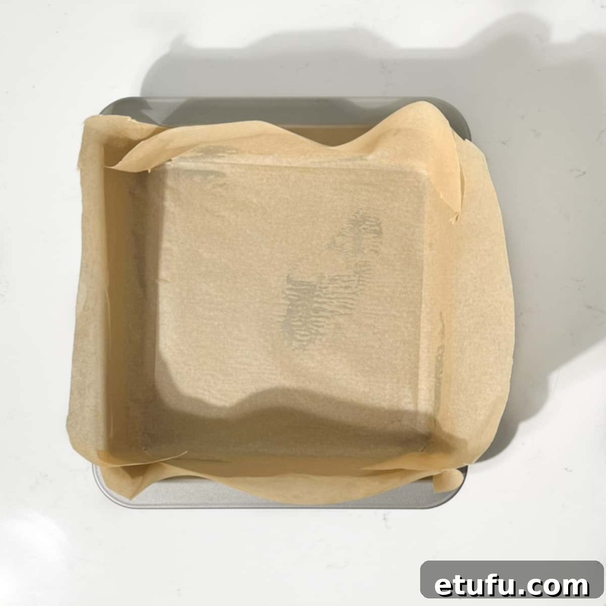 Lined baking tin for the fruity flapjacks.