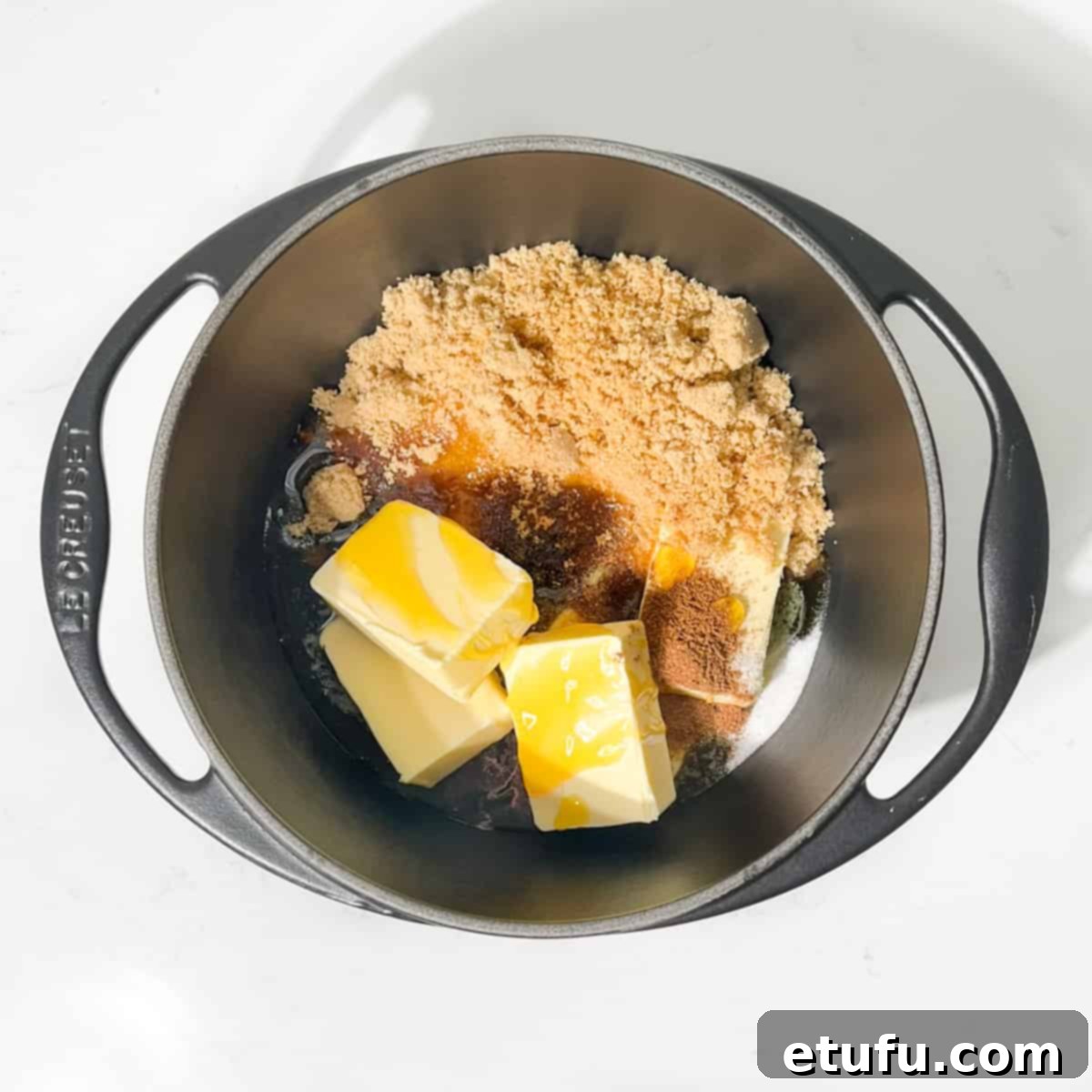 Adding the golden syrup, light brown sugar, butter, salt and spices to a large saucepan.