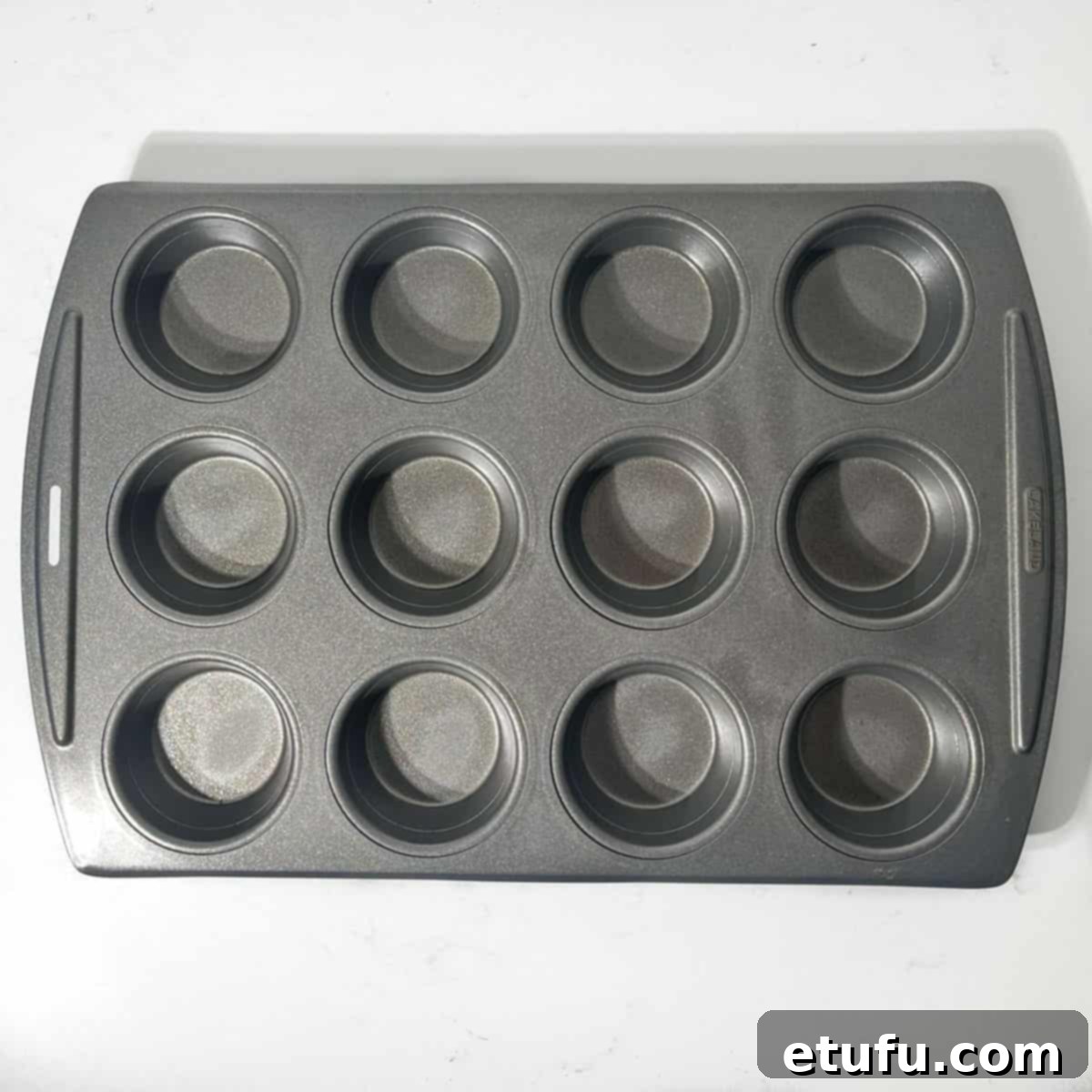 Greased 12-hole muffin tin. 