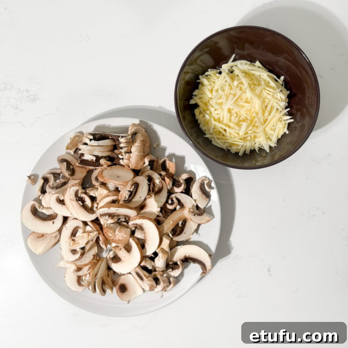 Sliced onions and grated gruyere.