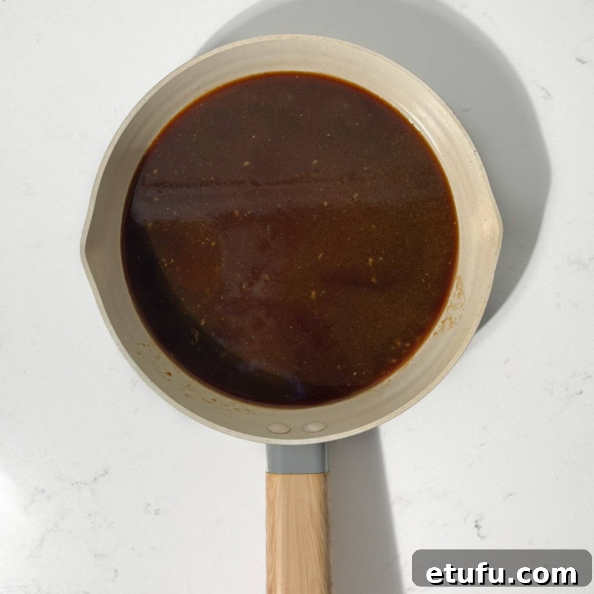 Leftover marinade in a small pan.