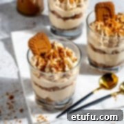 Three glasses of speculoos tiramisu on a white background.