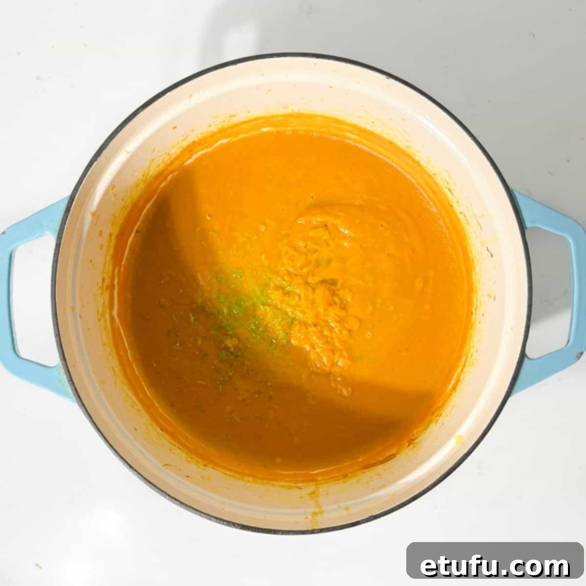 Adding lime zest to the sweet potato coconut and chilli soup.