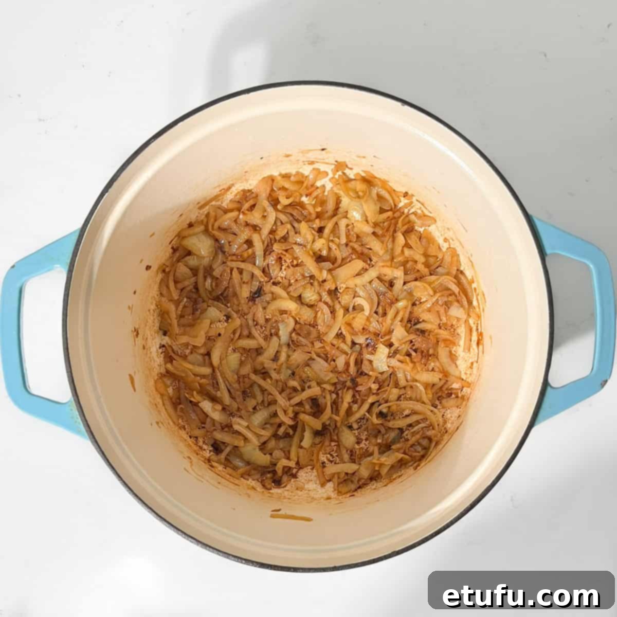 Caramelised onions in a large saucepan.