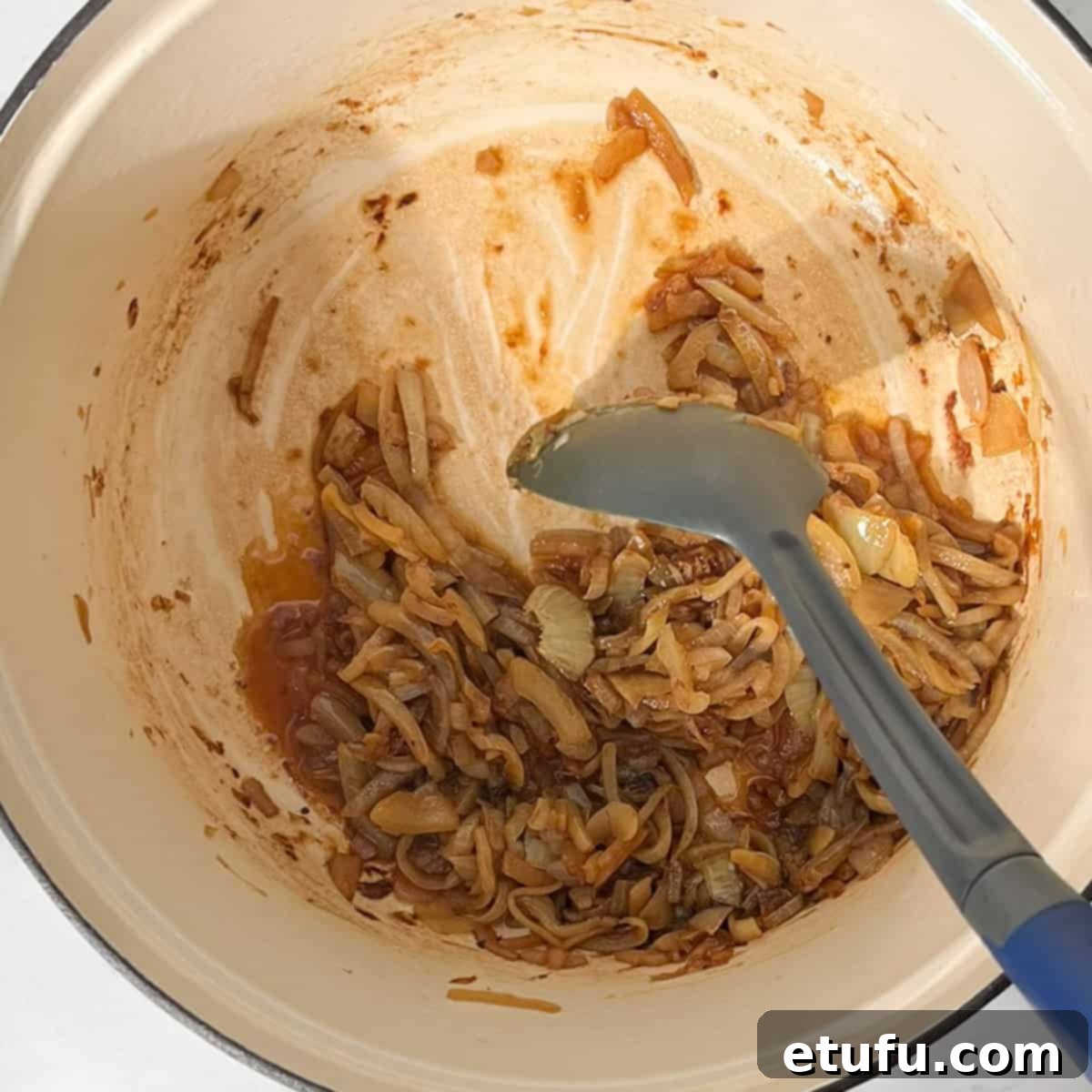 Deglazing the saucepan with a splash of water.
