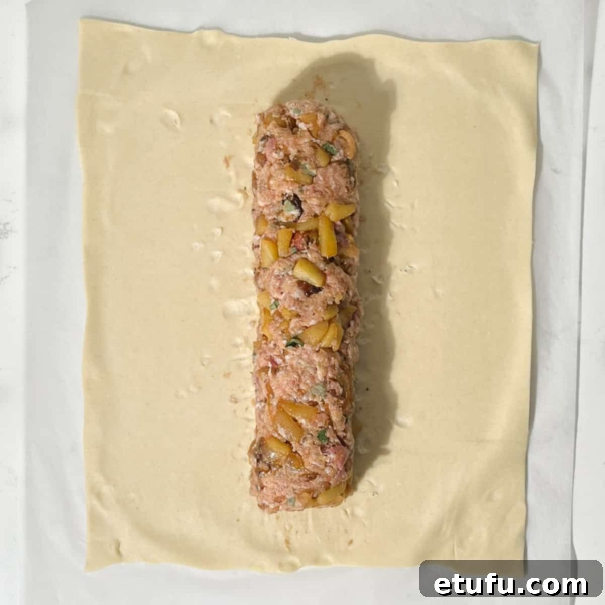 Shaping a sausage meat sausage for the sausage plait.