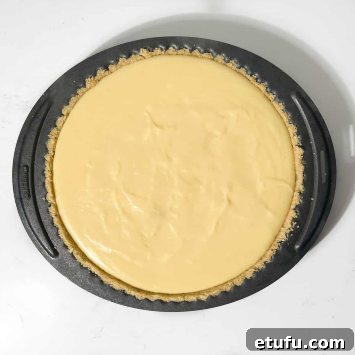 The completed milk tart, ready to be chilled in the fridge.
