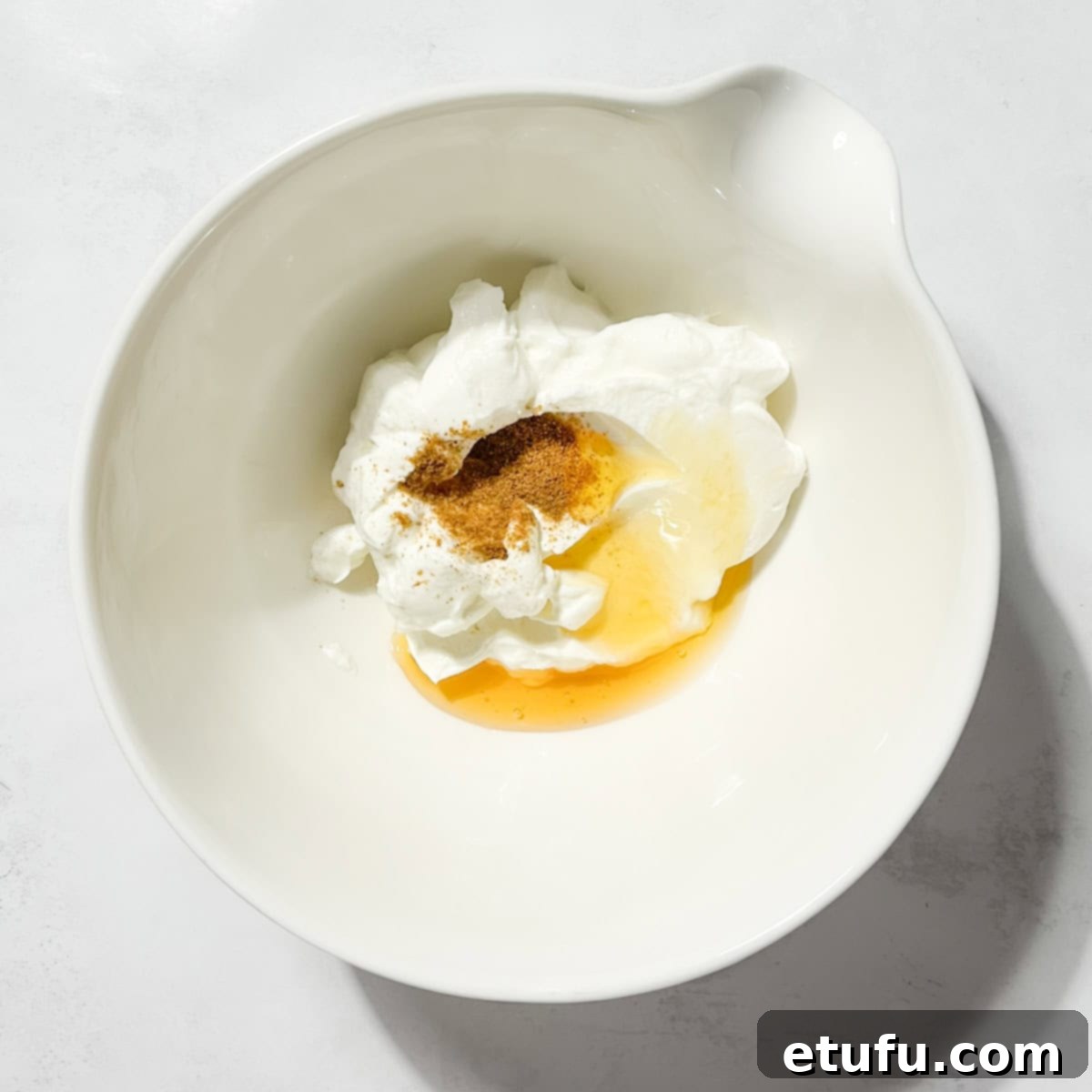 All the ingredients for the Greek yoghurt dressing in a bowl.