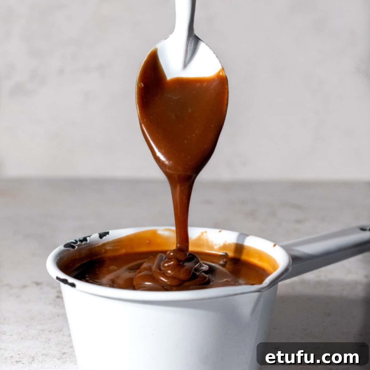 Finished Bar-one sauce in a white saucepan, ready to be transferred.