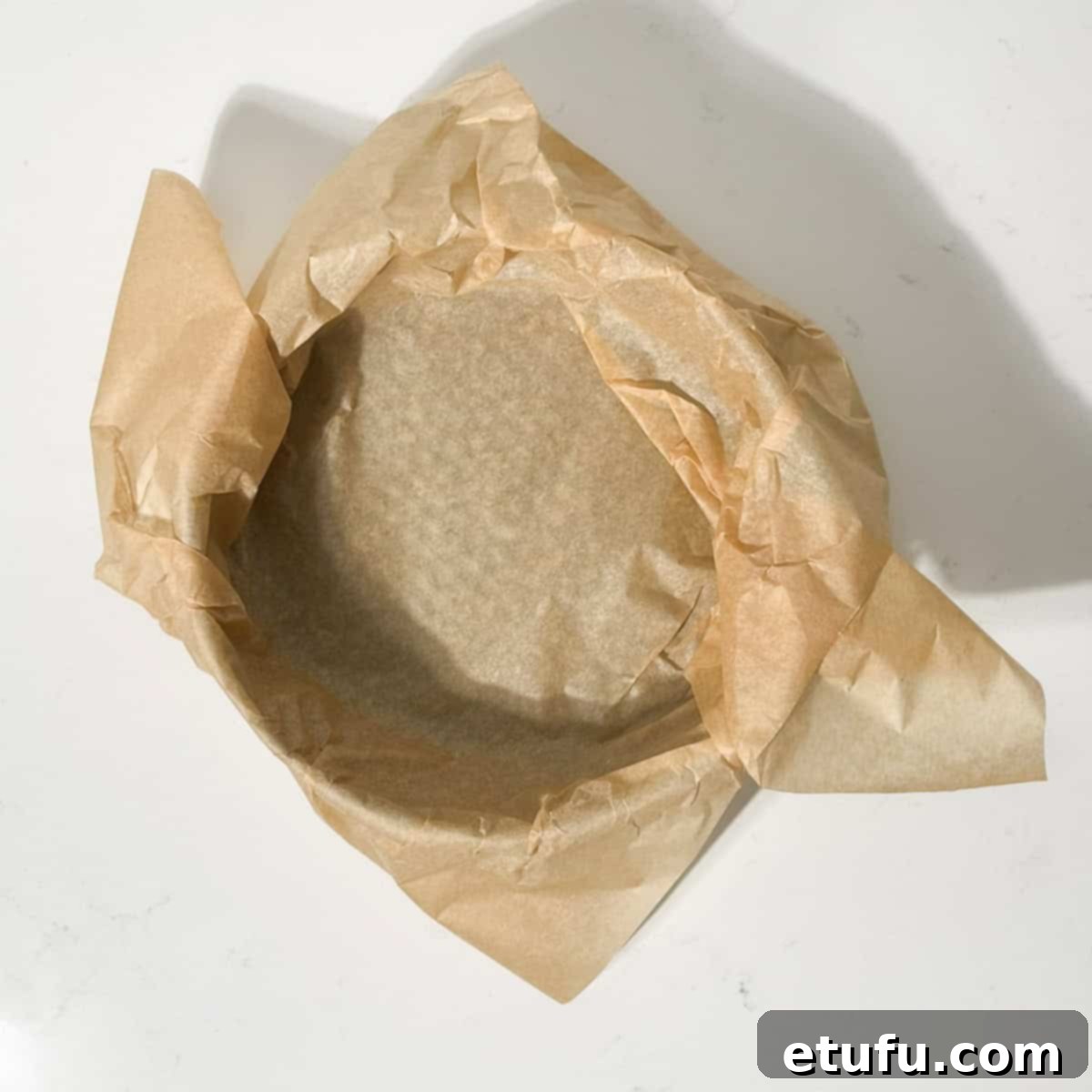 A baking tin lined with baking paper.