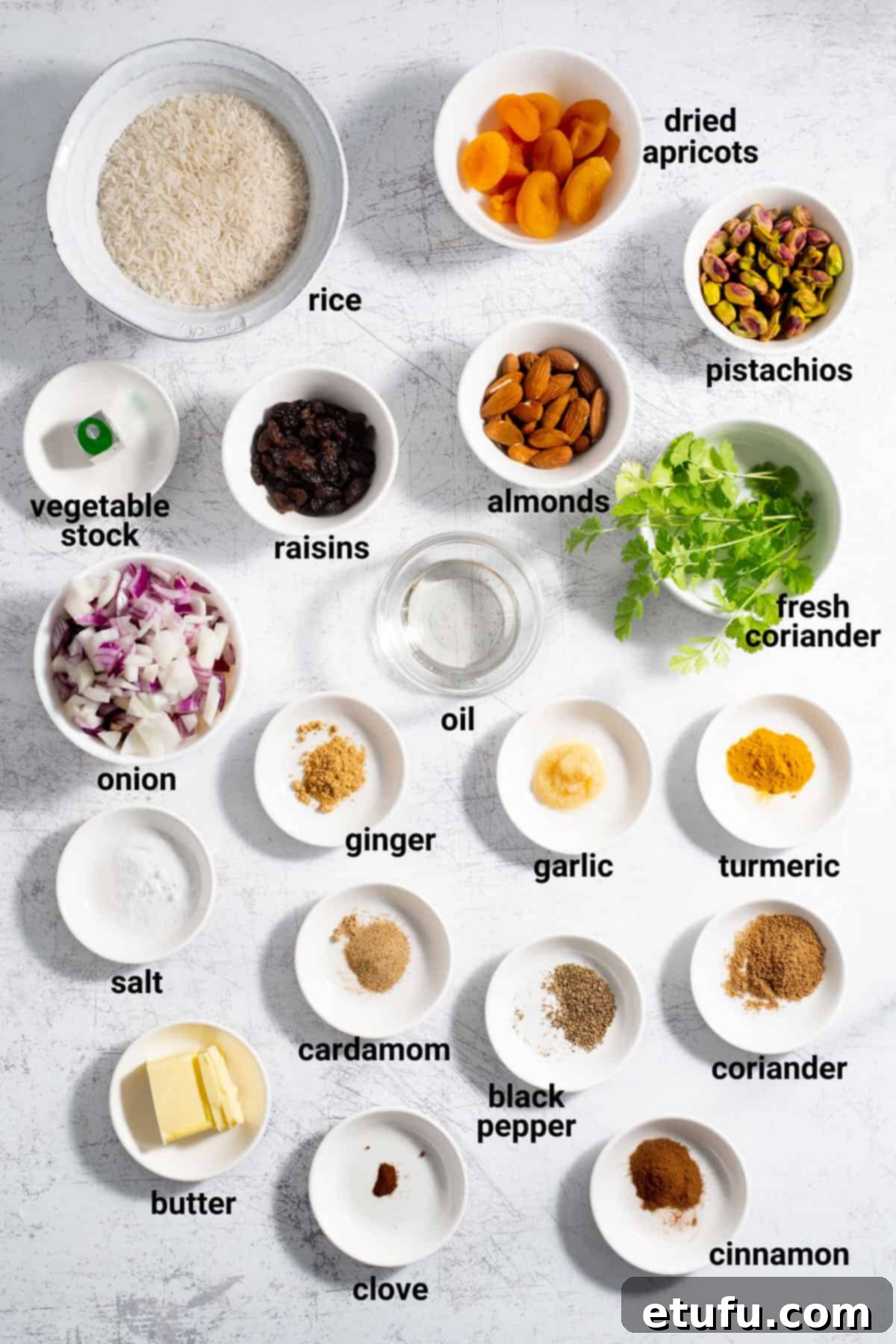 Sultan's Moroccan Pilaf 4 Assortment of fresh ingredients for Moroccan rice, including spices, basmati rice, dried fruits, and nuts.