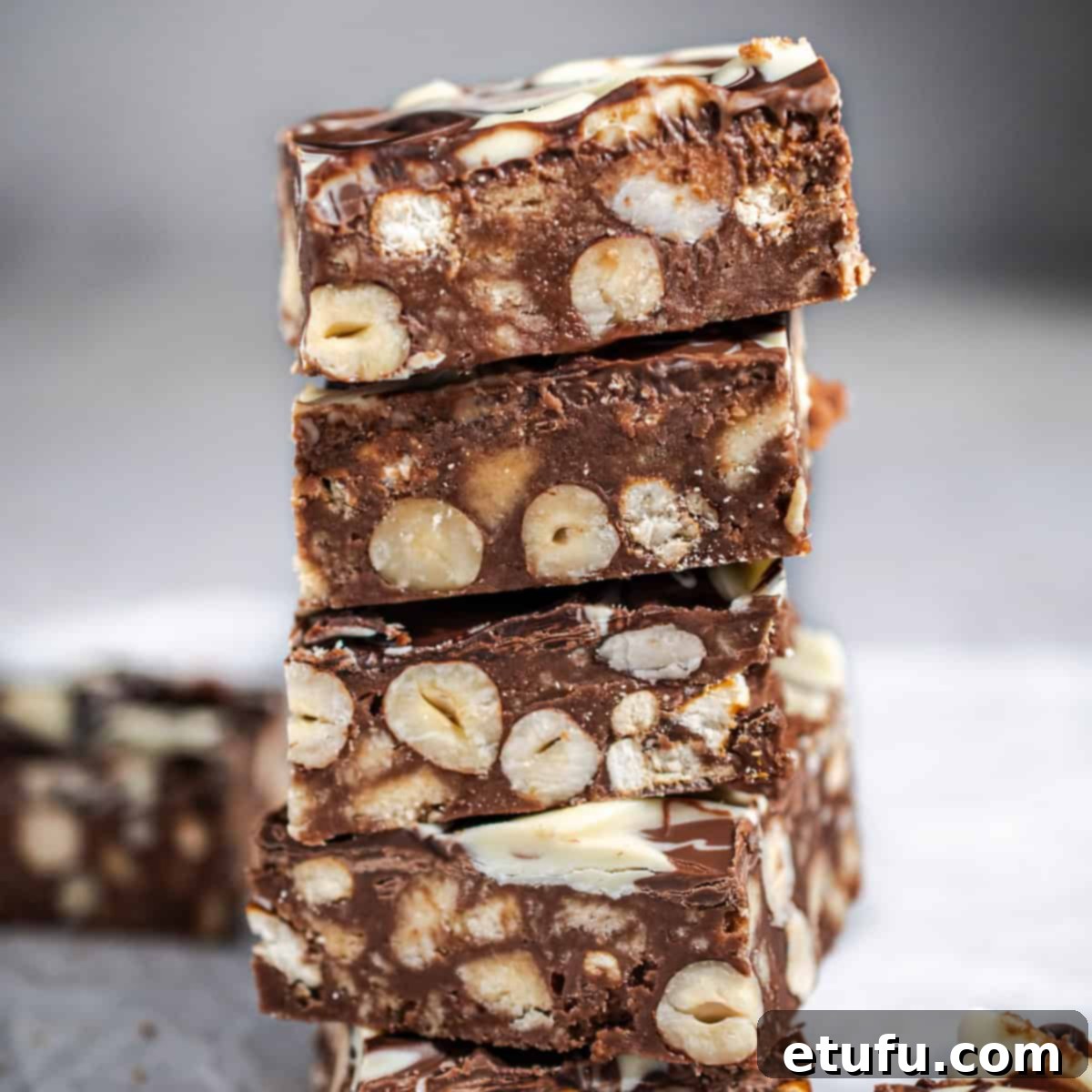 Decadent No-Bake Chocolate Biscuit Delight 14 Close-up of slices of chocolate biscuit cake, ready to be enjoyed.