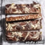 Decadent No-Bake Chocolate Biscuit Delight 15 Slices of chocolate biscuit cake, showing the marbled chocolate topping.